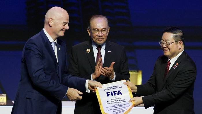 ASEAN Secretary-General Kao Kim Hourn, Malaysian Prime Minister Anwar Ibrahim and FIFA Chief Gianni Infantino attend a signing ceremony for the ASEAN-FIFA memorandum of understanding in football development on the sidelines of the 47th ASEAN Summit i