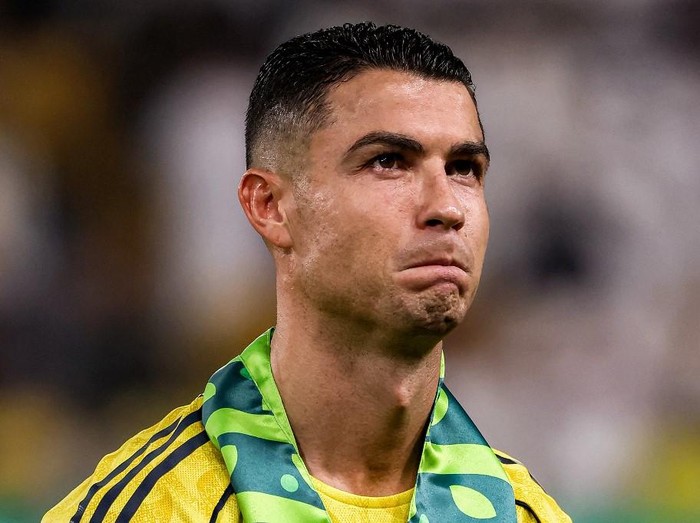 Cristiano Ronaldo Nassrs Portuguese forward #07 Cristiano Ronaldo looks on during the line-up before the Saudi Pro League football match between Al-Nassr and Al-Riyadh SC at Al-Awwal Park in Riyadh on September 20, 2025. (Photo by Fayez NURELDINE / AFP)