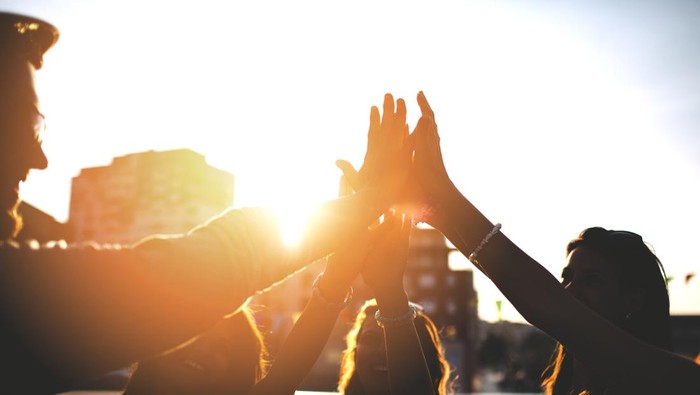 Ilustrasi pemuda Happy friends celebrating the success with high five