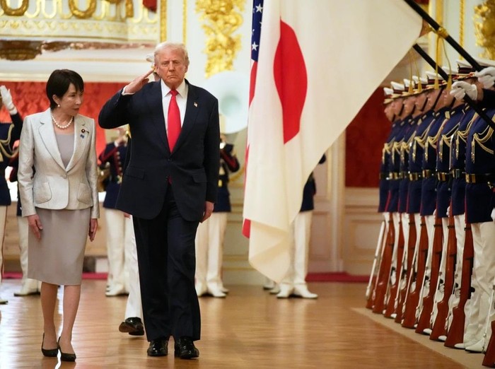 President Donald Trump, center, reviews an honour guard, escorted by Japan’s Prime Minister Sanae Takaichi on his arrival at Akasaka Palace in Tokyo, Japan, Tuesday, Oct. 28, 2025. (AP Photo/Mark Schiefelbein)