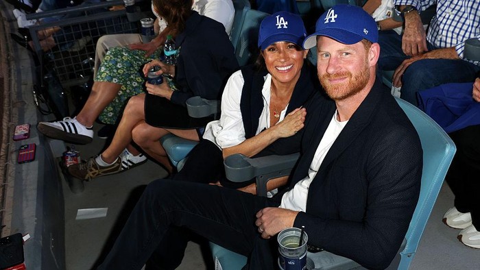 LOS ANGELES, CA - OCTOBER 28:  Prince Harry, Duke of Sussex and Meghan, Duchess of Sussex pose for a photo during Game Four of the 2025 World Series presented by Capital One between the Toronto Blue Jays and the Los Angeles Dodgers at Dodger Stadium on Tuesday, October 28, 2025 in Los Angeles, California. (Photo by Joe Scarnici/MLB Photos via Getty Images)