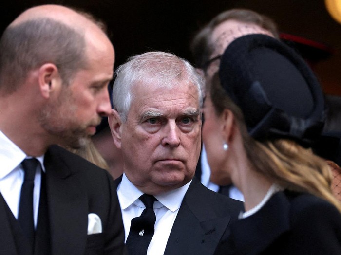 FILE PHOTO: Britains Prince Andrew speaks with King Charles as they leave Westminster Cathedral at the end of the Requiem Mass, on the day of the funeral of Britains Katharine, Duchess of Kent, in London, Britain, September 16, 2025. REUTERS/Toby Melville/File Photo