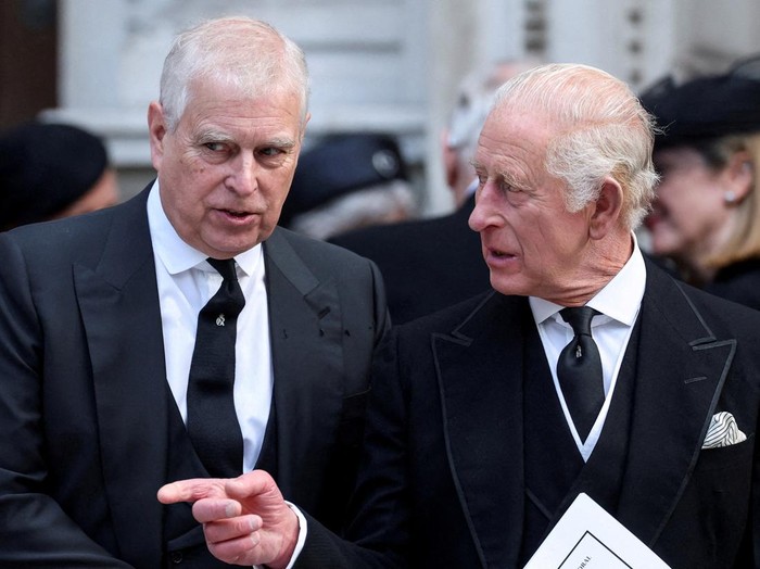 FILE PHOTO: Britains Prince Andrew speaks with King Charles as they leave Westminster Cathedral at the end of the Requiem Mass, on the day of the funeral of Britains Katharine, Duchess of Kent, in London, Britain, September 16, 2025. REUTERS/Toby Melville/File Photo