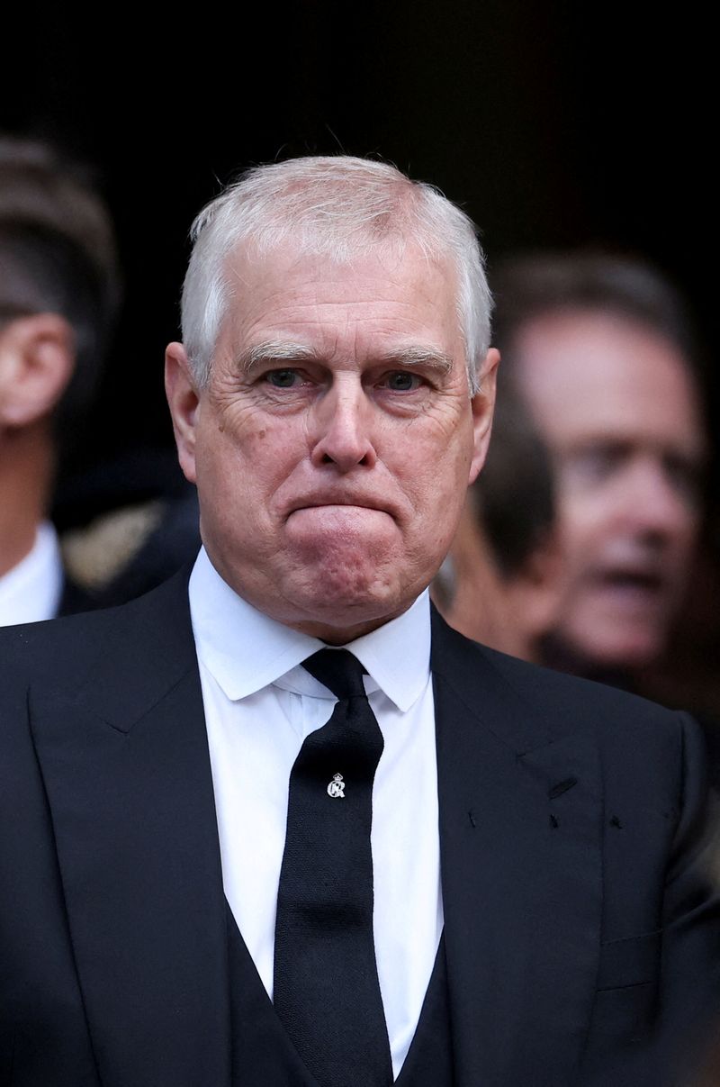 FILE PHOTO: Britain's Prince Andrew speaks with King Charles as they leave Westminster Cathedral at the end of the Requiem Mass, on the day of the funeral of Britain's Katharine, Duchess of Kent, in London, Britain, September 16, 2025. REUTERS/Toby Melville/File Photo