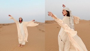 Luna tampil elegan dengan outfit krem yang menyatu sempurna dengan warna pasir gurun. Foto: Instagram Luna Maya