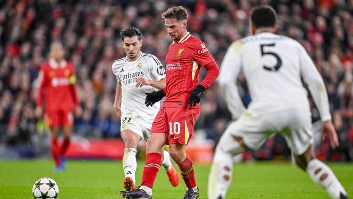Liverpool, England - November 27: Brahim Diaz of Real Madrid CF, Alexis Mac Allister of Liverpool FC and Jude Bellingham of Real Madrid CF battle for the ball during the UEFA Champions League 2024/25 League Phase MD5 match between Liverpool FC and Real Madrid C.F. at Anfield on November 27, 2024 in Liverpool, England. (Photo by Harry Langer/DeFodi Images via Getty Images)