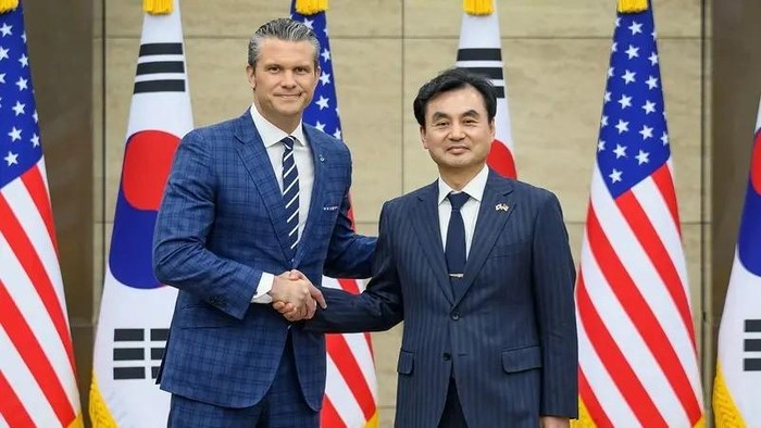 This handout photo taken on November 4, 2025 and provided by the South Korean Defence Ministry shows US Defense Secretary Pete Hegseth (L) shaking hands with South Korean Defence Minister Ahn Gyu-back (R) during the 57th Security Consultative Meeting at the Defence Ministry in Seoul. (Photo by Handout / South Korean Defense Ministry / AFP)