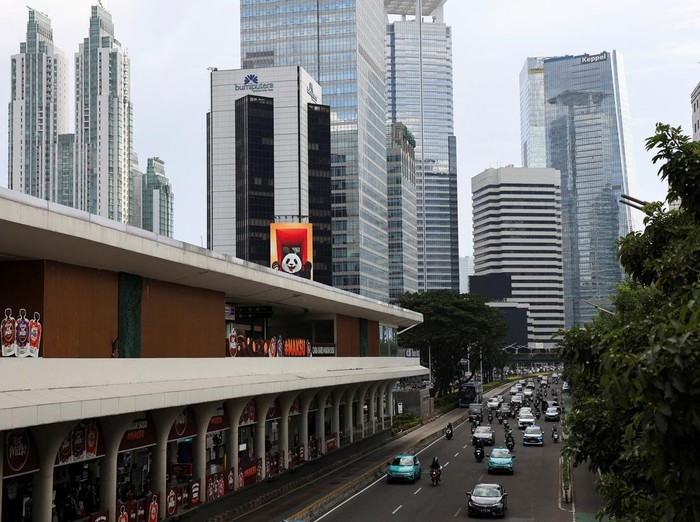 High-rise buildings are illuminated in the evening in Jakartas business district, Indonesia, November 4, 2025. REUTERS/Willy Kurniawan