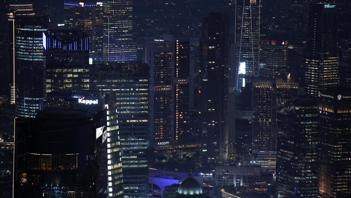 High-rise buildings are illuminated in the evening in Jakarta’s business district, Indonesia, November 4, 2025. REUTERS/Willy Kurniawan