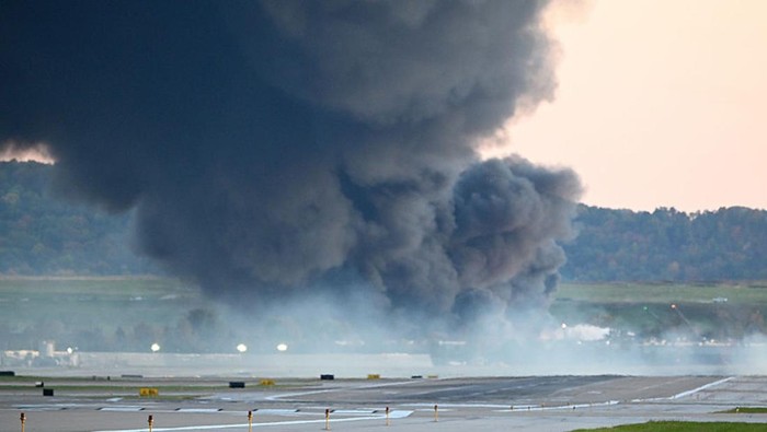 LOUISVILLE, KENTUCKY - NOVEMBER 04: Fire and smoke mark where a UPS cargo plane crashed near Louisville Muhammad Ali International Airport on November 04, 2025 in Louisville, Kentucky. The fully fueled plane crashed shortly after takeoff with a shelter-in-place order issued for within 5 miles of the airport. (Photo by Stephen Cohen/Getty Images)