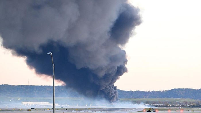 LOUISVILLE, KENTUCKY - NOVEMBER 04: Fire and smoke mark where a UPS cargo plane crashed near Louisville Muhammad Ali International Airport on November 04, 2025 in Louisville, Kentucky. The fully fueled plane crashed shortly after takeoff with a shelter-in-place order issued for within 5 miles of the airport. (Photo by Stephen Cohen/Getty Images)