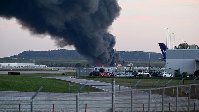 LOUISVILLE, KENTUCKY - NOVEMBER 04: Fire and smoke mark where a UPS cargo plane crashed near Louisville Muhammad Ali International Airport on November 04, 2025 in Louisville, Kentucky. The fully fueled plane crashed shortly after takeoff with a shelter-in-place order issued for within 5 miles of the airport. (Photo by Stephen Cohen/Getty Images)
