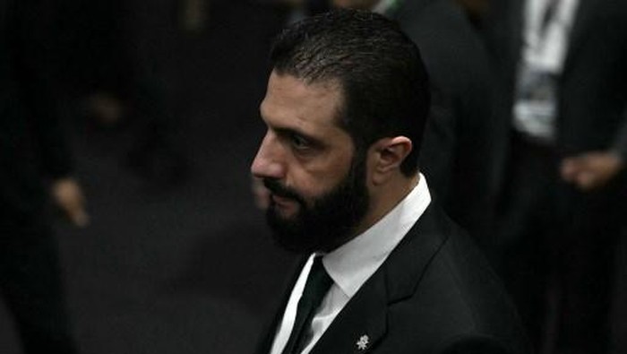 Syrias President Ahmad Al Sharaa walks on arrival at the General Plenary of Leaders in the framework of the COP30 UN Climate Change Conference in Belem, Para State, Brazil, on November 6, 2025. (Photo by Mauro PIMENTEL / AFP)