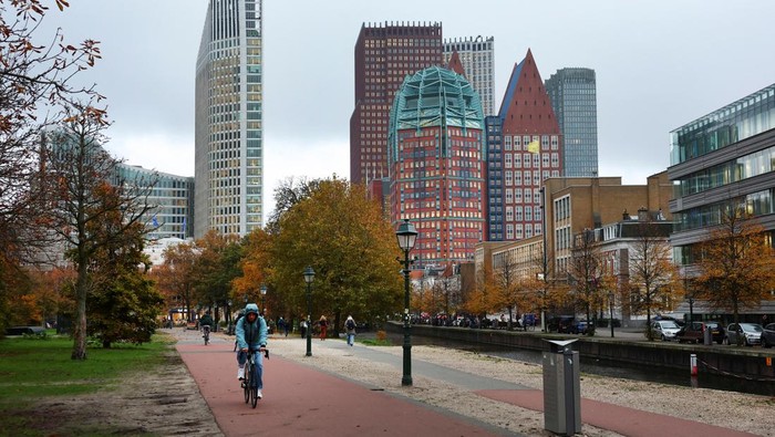 People cycle in The Hague, Netherlands, November 3, 2025. REUTERS/Piroschka van de Wouw