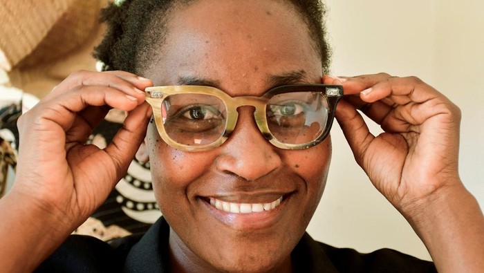 Grace Kansiime, Managing Director of Wazi Vision, displays eyewear frames made out of repurposed cow horns from slaughterhouses into stylish, eco-friendly eyeglass frames to make eye care more affordable and accessible, at their showroom on Bukoto-Ntinda road, in Kampala, Uganda, November 5, 2025. REUTERS/Abubaker Lubowa