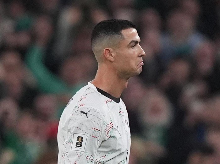 Portugals Cristiano Ronaldo hands the arm band to team-mate Bernardo Silva after being shown a red card during the 2026 FIFA World Cup European Qualifying, Group F match at the Aviva Stadium in Dublin, Ireland. Picture date: Thursday November 13, 2025. (Photo by Niall Carson/PA Images via Getty Images)