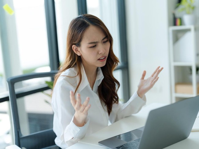 Shot of young asian woman, Business woman facing failure at work in her workstation office.