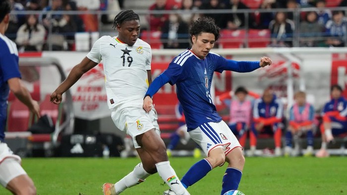 TOYOTA, JAPAN - NOVEMBER 14:  Francis Abu of Ghana breaks his leg as he is kicked by Ao Tanaka of Japan during the international friendly match between Japan and Ghana at Toyota Stadium on November 14, 2025 in Toyota, Aichi, Japan. (Photo by Etsuo Hara/Getty Images)