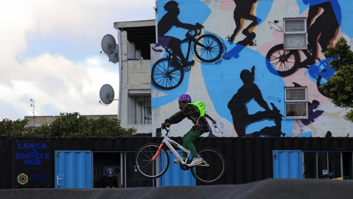 Mzikhona Mgedle, founder of Langa Bicycle Hub, cycles with young riders through the streets of Langa township during an awareness ride, in Cape Town, South Africa, November 7, 2025. REUTERS/Esa Alexander