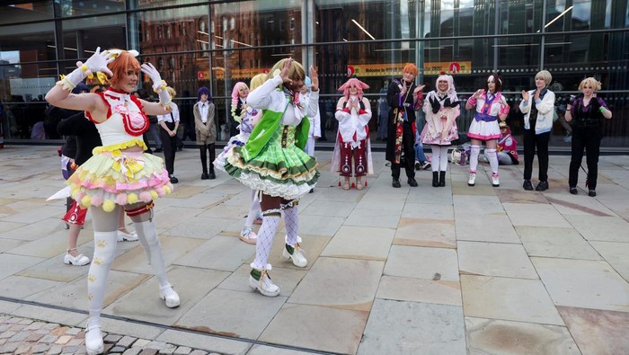 Visitors check an exhibition of anime art during Hyper Japan, a major festival showcasing Japanese culture taking place at the Manchester Central Convention Complex, in Manchester, Britain, November 16, 2025. REUTERS/Temilade Adelaja