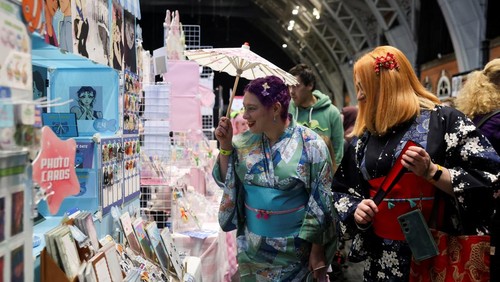 Visitors check an exhibition of anime art during Hyper Japan, a major festival showcasing Japanese culture taking place at the Manchester Central Convention Complex, in Manchester, Britain, November 16, 2025. REUTERS/Temilade Adelaja