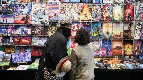 Visitors check an exhibition of anime art during Hyper Japan, a major festival showcasing Japanese culture taking place at the Manchester Central Convention Complex, in Manchester, Britain, November 16, 2025. REUTERS/Temilade Adelaja