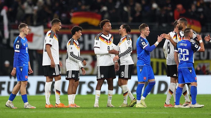 LEIPZIG, GERMANY - NOVEMBER 17: Assan Ouedraogo and Leroy Sane of Germany celebrate after the teams victory in the FIFA World Cup 2026 qualifier match between Germany and Slovakia at Red Bull Arena on November 17, 2025 in Leipzig, Germany. (Photo by Maja Hitij/Getty Images)