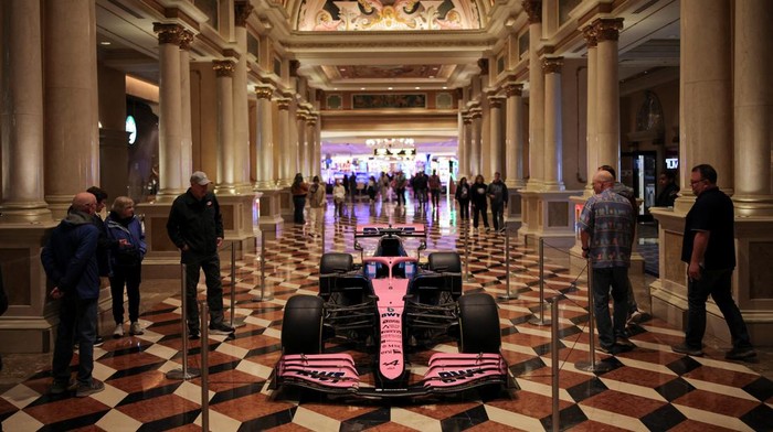 Visitors look at a Formula One car, on display at The Venetian Las Vegas casino, as preparations for the Formula One F1 - Las Vegas Grand Prix continue in Las Vegas, Nevada, U.S., November 18, 2025. REUTERS/Daniel Cole