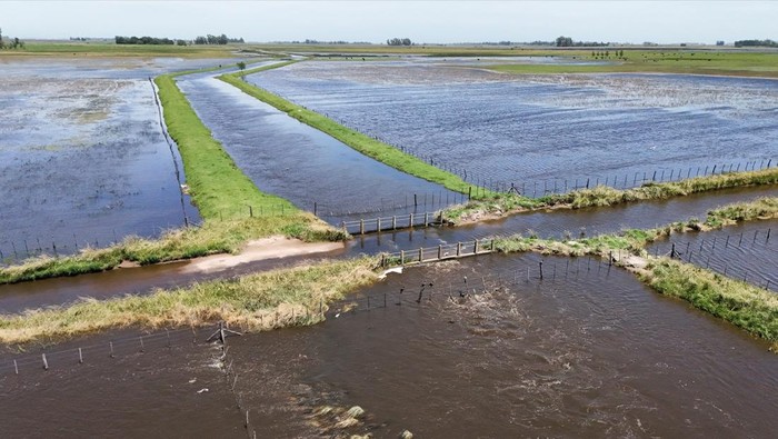 A drone view shows floodwater covering agricultural fields in 12 de Octubre, where excessive rains have left more than 1.5 million hectares at risk of remaining unproductive, in Buenos Aires province, Argentina, November 17, 2025. REUTERS/Agustin Marcarian