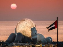 KAWS Rebahan Sambil Peluk Bulan di Abu Dhabi