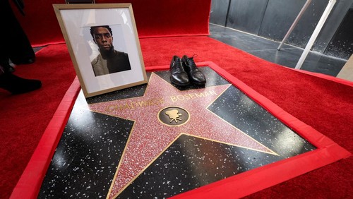 A photo of late filmmaker Chadwick Boseman sits next to a pair of shoes on his unveiled star on the Hollywood Walk of Fame in Los Angeles, California, U.S., November 20, 2025. REUTERS/Mario Anzuoni