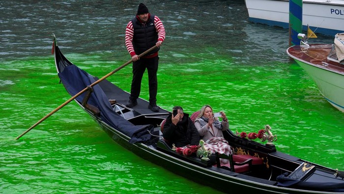 The Grand Canal, where the canal's water has been dyed green in a protest organised by the 
