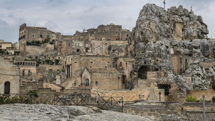 MATERA, ITALY - MAY 09:  Santa Maria Idris church (top right) is located on a spur that rises from the Sasso Caveoso area, on May 09, 2023 in Matera, Italy. The Sassi of Matera are two districts Sasso Caveoso and Sasso Barisano of the Italian city of Matera, Basilicata, well-known for their ancient cave dwellings inhabited since the Paleolithic period. Along with the park of the Rupestrian Churches, it was named a World Heritage Site by UNESCO in 1993 and was chosen as the European Capital of Culture 2019. (Photo by Alessandra Benedetti - Corbis/Corbis via Getty Images)