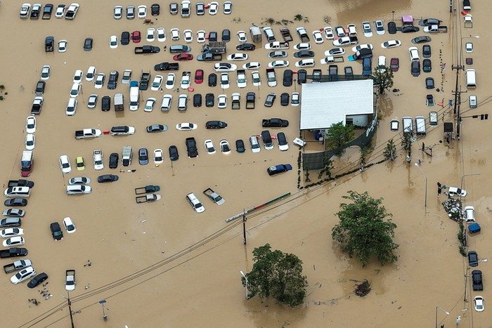A drone view shows cars parked in a flooded area in Hat Yai district, affected by heavy rainfall, which has impacted 10 provinces in southern Thailand and killed several people, in Songkhla province, Thailand, November 25, 2025. REUTERS/Tannarin Suchipong