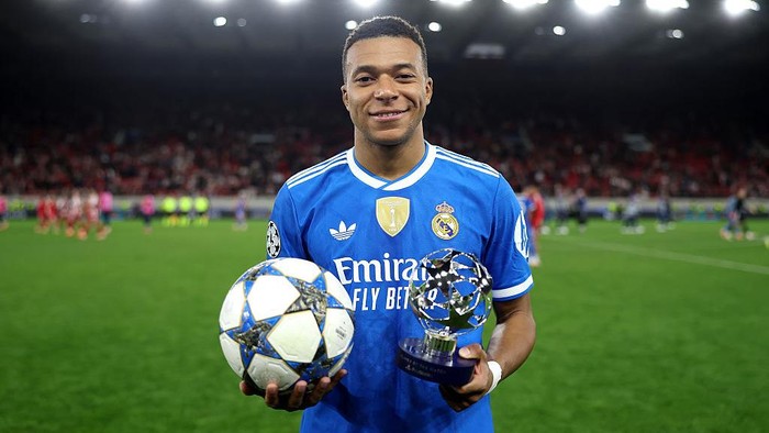 PIRAEUS, GREECE - NOVEMBER 26: Kylian Mbappe of Real Madrid poses for a photo with the match ball and the 