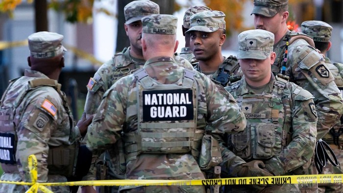Law enforcement respond at the scene after two National Guard members were shot near the White House in Washington, D.C., U.S., November 26, 2025. Mike Ryan/Handout via REUTERS  THIS IMAGE HAS BEEN SUPPLIED BY A THIRD PARTY. NO RESALES. NO ARCHIVES.