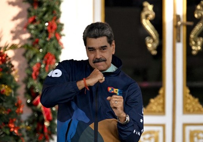 Venezuelas President Nicolas Maduro dances during the student day celebrations at Miraflores palace in Caracas, November 21, 2025. (Photo by Juan BARRETO / AFP)