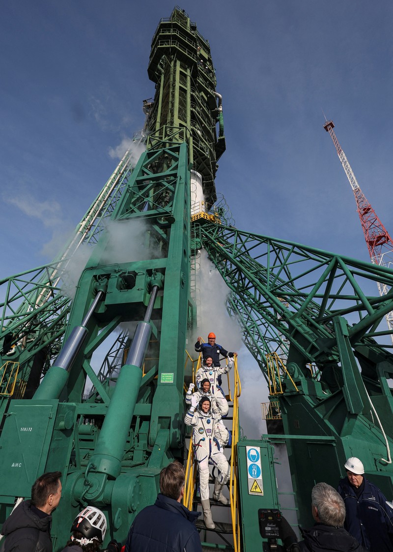 NASA astronaut Chris Williams, Roscosmos cosmonauts Sergey Kud-Sverchkov and Sergey Mikaev board the Soyuz MS-28 spacecraft ahead of the expedition to the International Space Station (ISS) on the launch pad at the Baikonur Cosmodrome, Kazakhstan, November 27, 2025. Maxim Shipenkov/Pool via REUTERS