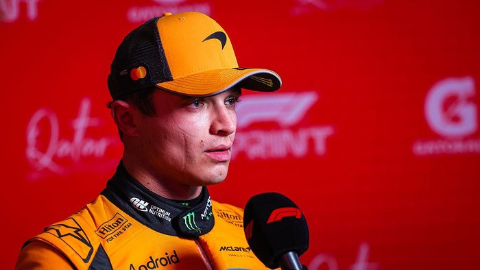 LUSAIL CITY, QATAR - NOVEMBER 28: Lando Norris of Great Britain and McLaren answers questions in the TV media pen during sprint qualifying ahead of the F1 Grand Prix of Qatar at Lusail International Circuit on November 28, 2025 in Lusail City, Qatar. (Photo by Jayce Illman/Getty Images)