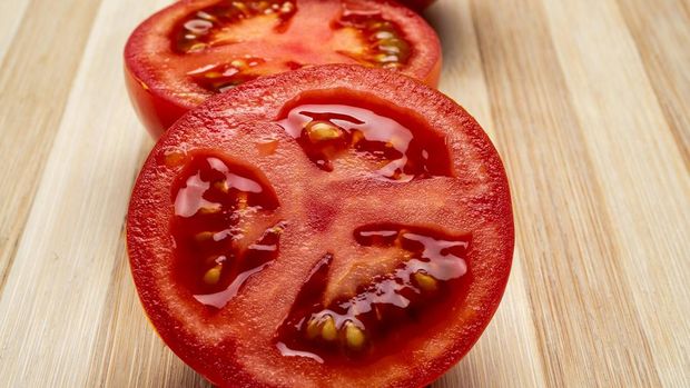 1248795427 Fresh red tomatoes, a vegetable widely used in the Mediterranean diet.