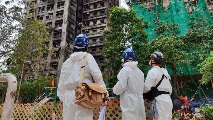 Members of the Hong Kong Police Forces Disaster Victims Identification Unit (DVIU) operate during a search operation at the Wang Fuk Court housing complex, in Hong Kong, China, November 30, 2025. Hong Kong Police Force/Handout via REUTERS    THIS IMAGE HAS BEEN SUPPLIED BY A THIRD PARTY. NO RESALES. NO ARCHIVES. MANDATORY CREDIT.