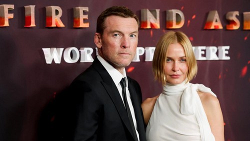 Cast member Sam Worthington and his wife Lara Worthington attend the premiere for the film 'Avatar: Fire and Ash', in Los Angeles, California, U.S. December 1, 2025. REUTERS/Mario Anzuoni