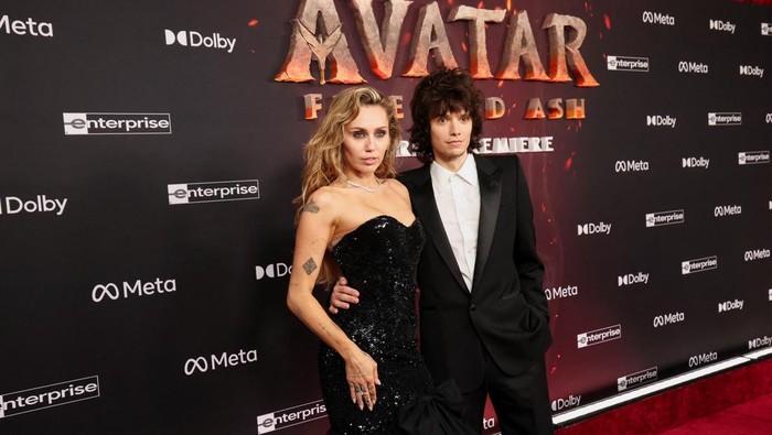 Miley Cyrus and Maxx Morando attend the premiere for the film 'Avatar: Fire and Ash', in Los Angeles, California, U.S., December 1, 2025. REUTERS/Mario Anzuoni