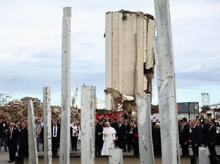 Pope Leo XIV holds a silent prayer at the site of the Beirut port blast in August 2020, during his first apostolic journey, in Beirut on Dec. 2, 2025. (AFP)