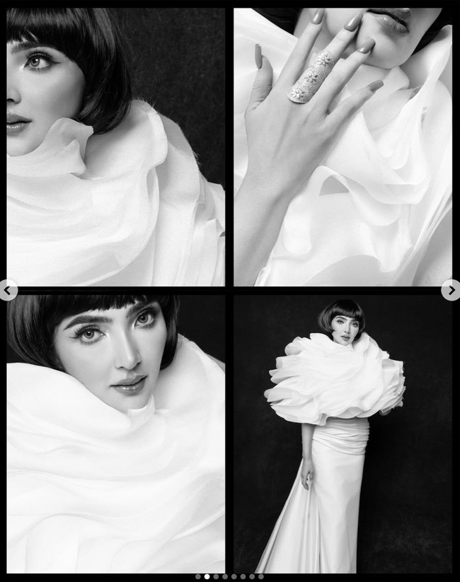 Ashanty mengenakan gaun putih unik rancangan desainer Julianto. Gaun tersebut memiliki detail bagian atas berupa susunan ruffles besar menyerupai kelopak bunga raksasa. Foto: Instagram/@mozawahyu