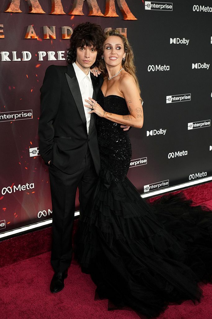 HOLLYWOOD, CALIFORNIA - DECEMBER 01: (L-R) Maxx Morando and Miley Cyrus attend the Global Premiere of 20th Century Studios' 