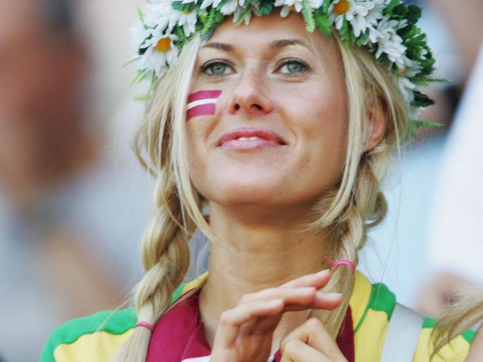 AVEIRO, PORTUGAL - JUNE 15:  A Latvian fan watches her team during the UEFA Euro 2004 Group D match between Czech Republic and Latvia at the Estadio Municipal de Aveiro on June 15, 2004 in Aveiro, Portugal. (Photo by Phil Cole/Getty Images)