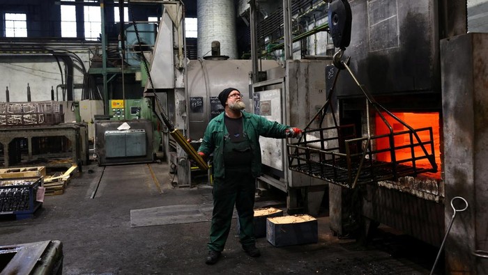 A calendar featuring Hungarian metalworkers posing half-naked sits at a steel workshop in Budapest, Hungary, December 5, 2025. REUTERS/Bernadett Szabo