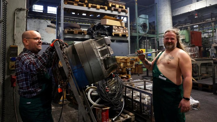 A calendar featuring Hungarian metalworkers posing half-naked sits at a steel workshop in Budapest, Hungary, December 5, 2025. REUTERS/Bernadett Szabo