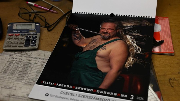 A calendar featuring Hungarian metalworkers posing half-naked sits at a steel workshop in Budapest, Hungary, December 5, 2025. REUTERS/Bernadett Szabo